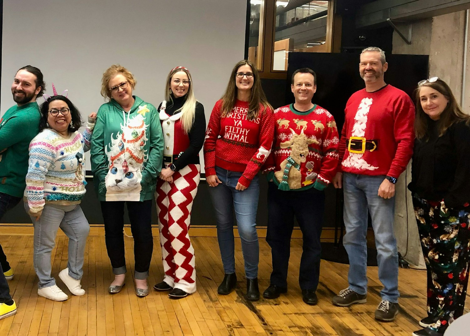 A snapshot of camaraderie and the commitment to making TPG great, one ugly sweater—and one successful project—at a time.
